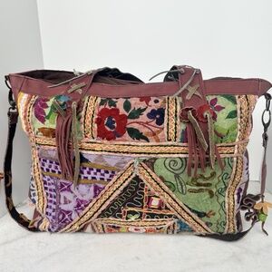 These are large, floral embroidered leather handbags and totes for women,